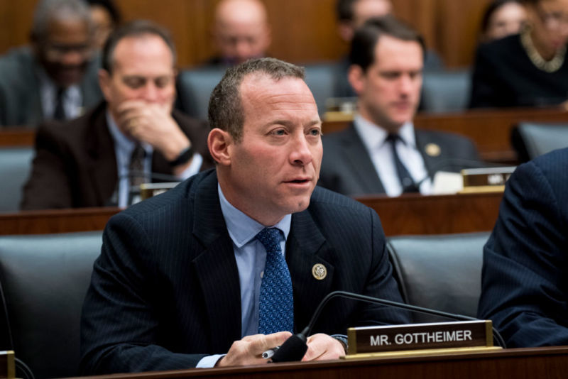 Rep. Josh Gottheimer seated in front of a microphone at a Congressional committee meeting.