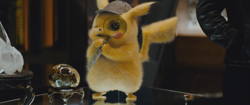 How do you know it's <em>Detective</em> Pikachu, not just standard Pikachu? Clues: the hat, the magnifying glass, the lush fur.