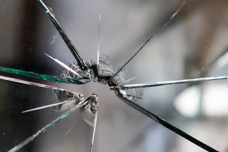 Image of a broken glass window.