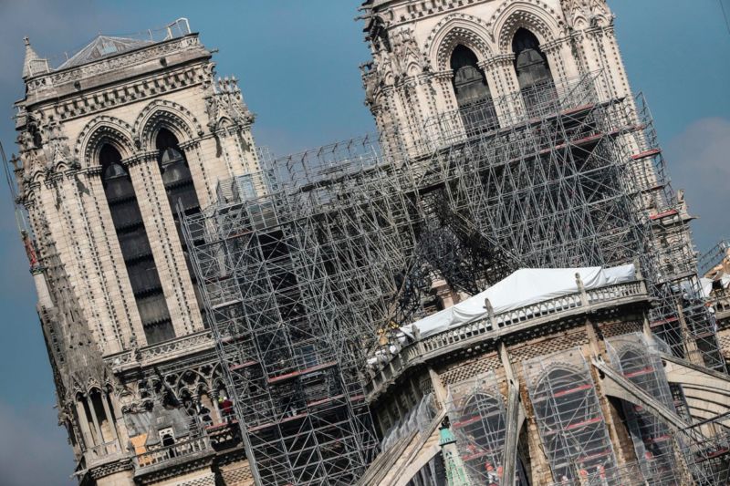 Protective tarps displayed on the roof of Notre-Dame de Paris cathedral, two weeks after a fire devastated it in Paris.