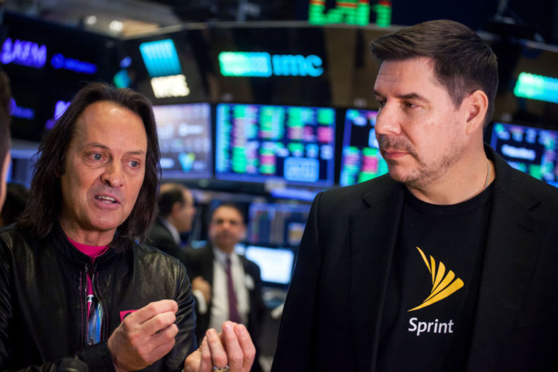 T-Mobile CEO John Legere and Sprint CEO Marcelo Claure speak during an interview.