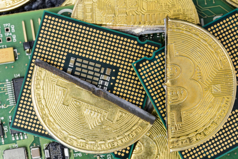 Stylized, composite image of bitcoins against motherboards.