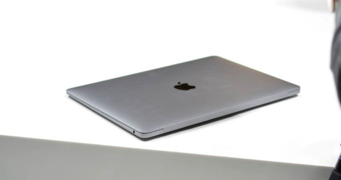 The 2018 MacBook Air sitting on a white table.