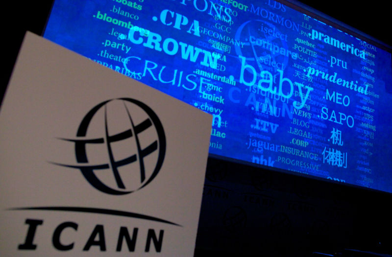 Video presentation behind a podium with an ICANN logo.