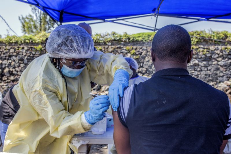 A man receives a vaccine against Ebola from a nurse outside the Afia Himbi Health Center on July 15, 2019 in Goma. 