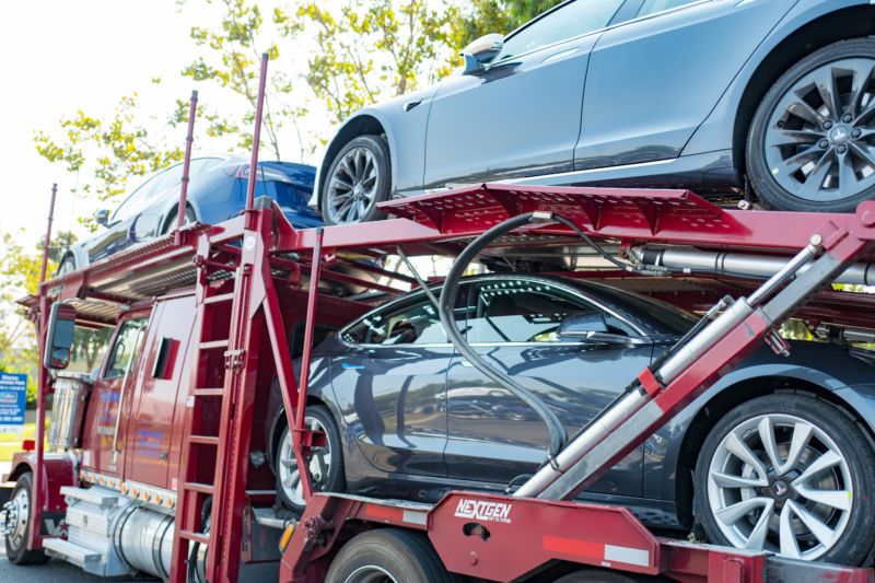 Tesla cars on a delivery truck in 2018.